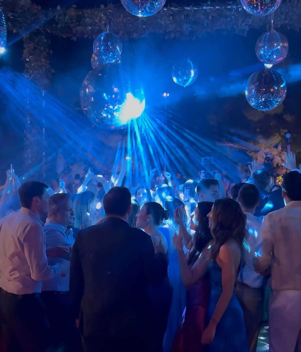 luxury-party-lighting-setup-with-disco-balls-and-blue-light-rays